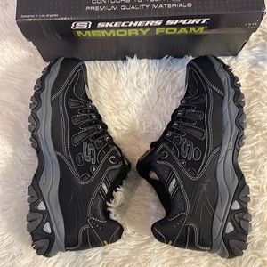 Black and gray Skechers sport shoes